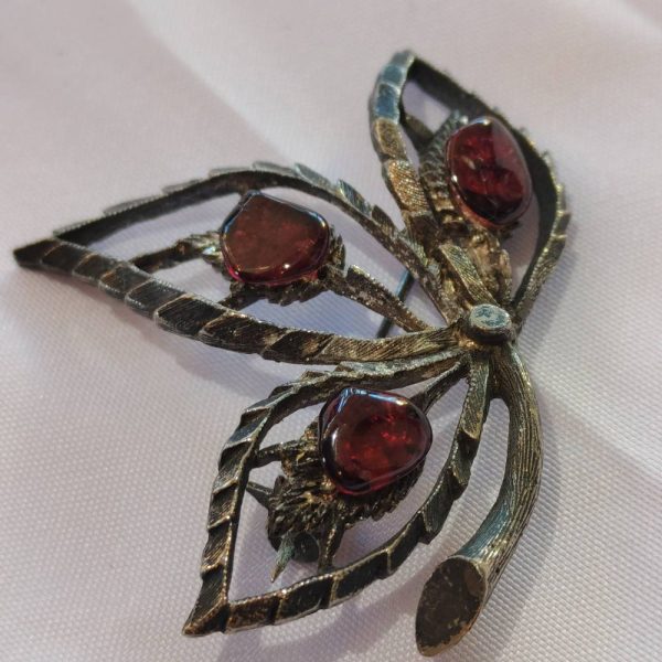 Silver and garnet brooch